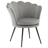 BukkitBow bloemvormige velvet fauteuil met zwarte metalen poten, zachte roodachtige bekleding en stijlvolle design.