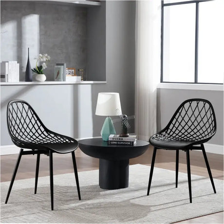 Set van 4 BukkitBow eetkamerstoelen met holle rugleuning, Scandinavisch ontwerp en metalen poten, geschikt voor keuken en eethoek.