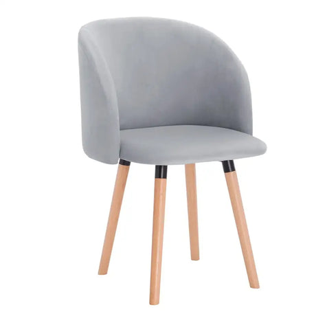 BukkitBow fluwelen eetkamerstoel met massief houten frame, ergonomisch design en zithoogte van 47 cm.