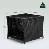 Luxe polyrattan bijzettafel van BukkitBow met glazen blad en opbergvak, geschikt voor buiten.