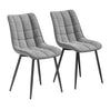 Twee luxe velvet eetkamerstoelen van BukkitBow met metalen poten, elegante zitplaatsen voor in de eetkamer.