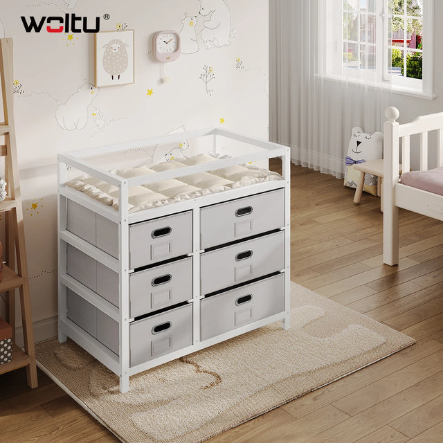 Moderne BukkitBow commode in wit en grijs met 6 laden en aankleedblad, geschikt voor slaapkamer of kinderkamer.