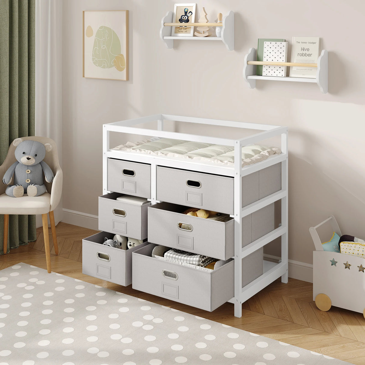 Moderne BukkitBow commode in wit en grijs met 6 laden en aankleedblad, geschikt voor slaapkamer of kinderkamer.