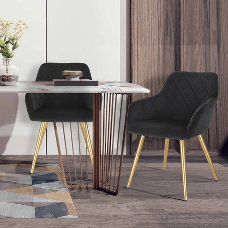 Moderne velvet eetkamerstoel van BukkitBow met armleuningen en metalen poten, comfortabele en stijlvolle zitplaats.