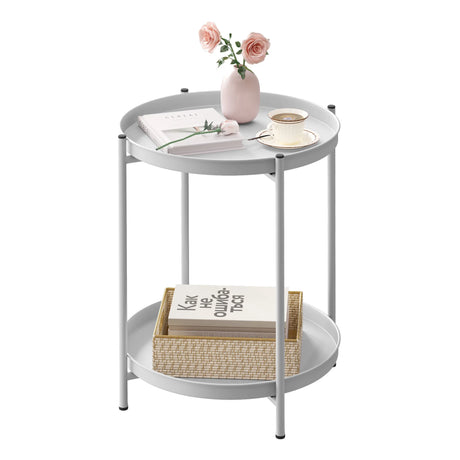 Ronde salontafel van BukkitBow met metalen frame en twee afneembare dienbladen, geschikt als bijzettafel.