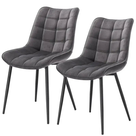 Set van 2 BukkitBow eetkamerstoelen met leren, stoffen en fluwelen bekleding, metalen poten en ergonomisch ontwerp.