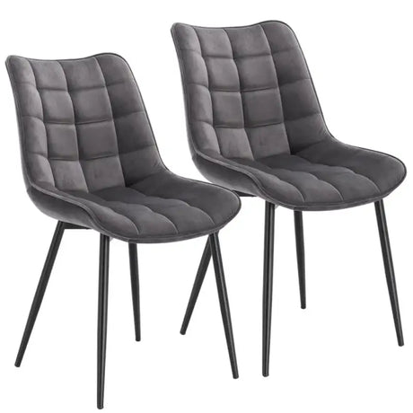 Set van 2 BukkitBow eetkamerstoelen met leren, stoffen en fluwelen bekleding, metalen poten en ergonomisch ontwerp.